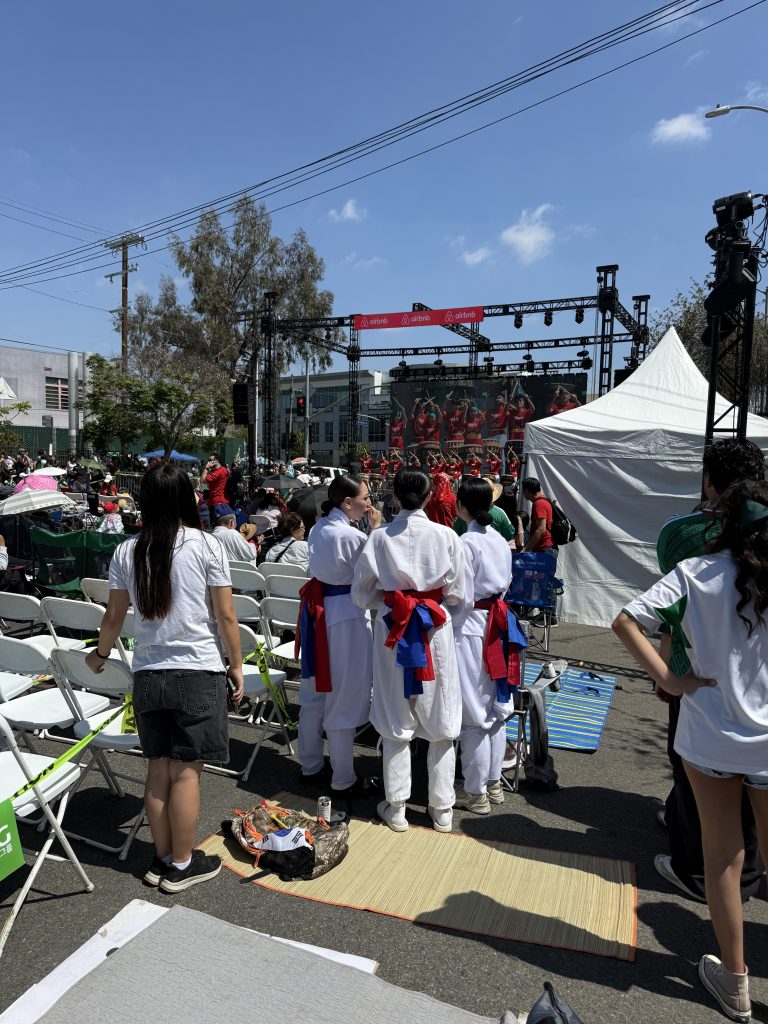 Audience and performers gathering near the Seoul International Park watch party stage